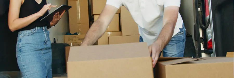 delivery van with boxes and customer checking order